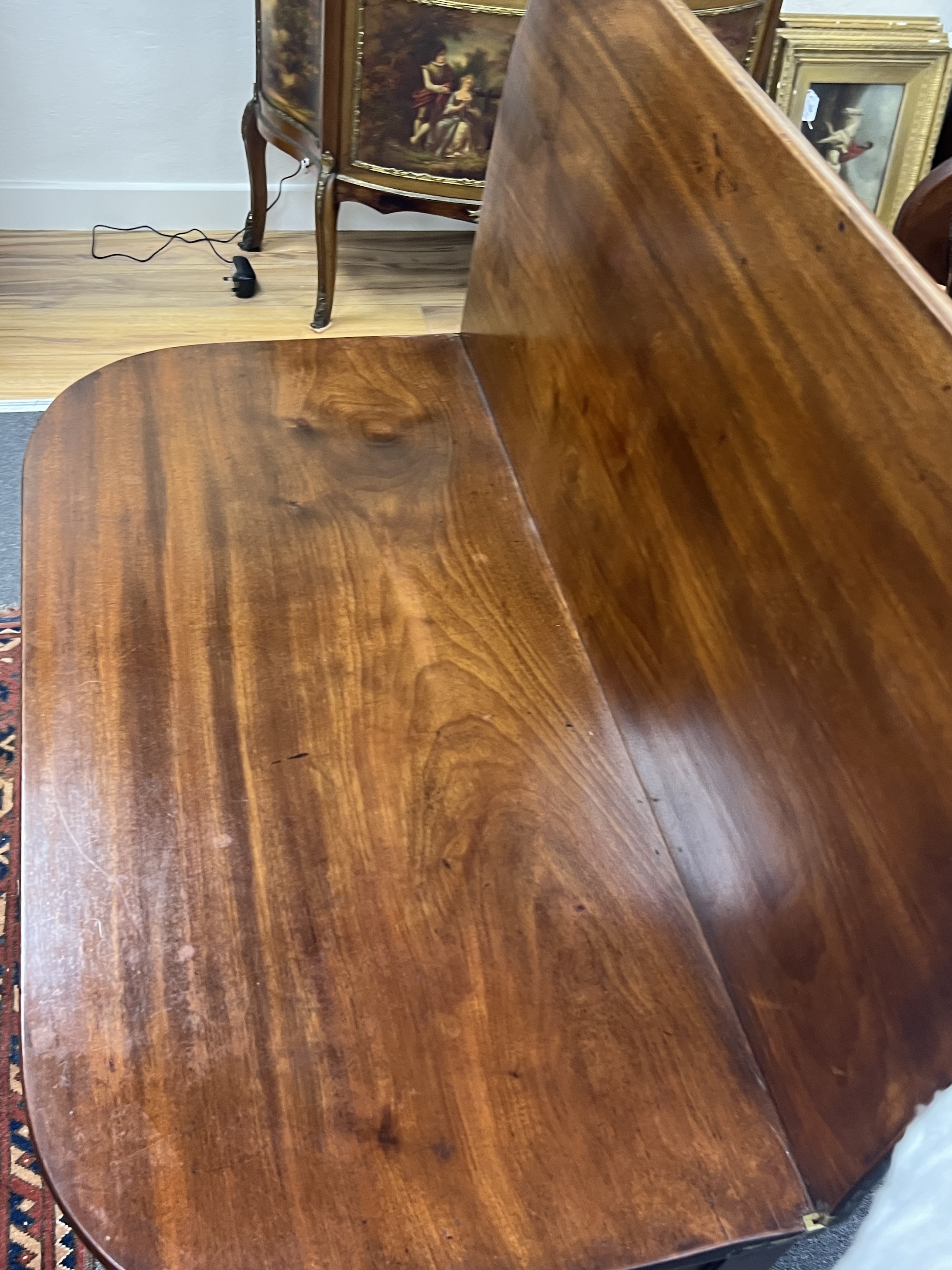 A George III mahogany D shaped folding tea table, width 85cm, depth 40cm, height 73cm